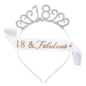 Close-up of sparkling 18th birthday crown and white 18 & Fabulous satin sash set