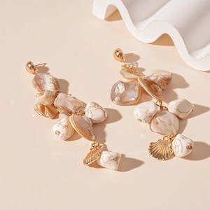 Ocean style starfish earrings with iridescent shell pieces and gold shell pendants