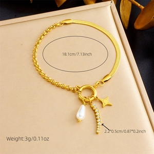 Detail showing gold chain bracelet with water drop pearl, curved bar and star charm