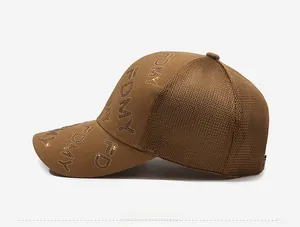Detail view of brown trucker hat with rhinestones and breathable mesh side panel
