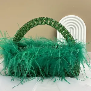 Macro view of bright green ostrich feathers and handcrafted crystal beaded bag handle
