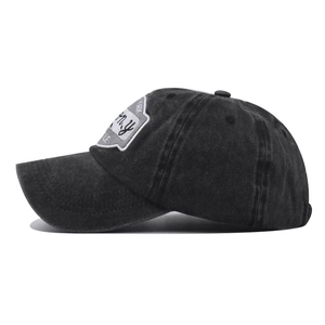 Detail of vintage washed black cotton baseball cap with retro 1865 embroidery