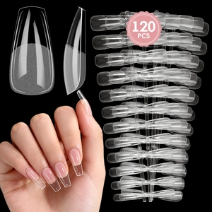 Macro view of 120pcs long coffin shaped clear false nails with semi-matte base detail