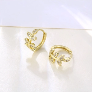 Elegant gold-tone leaf drop earrings featuring hollow zircon inlay in a forest style