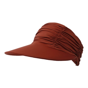 Detail of caramel sun visor hat with pleated elastic fabric and wide brim protection