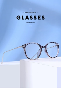 Detail view of cat eye anti-blue light glasses with blue tortoise frame and silver temples