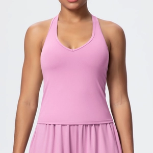 Close-up of pink V-neck sports top featuring quick-dry fabric for yoga and fitness