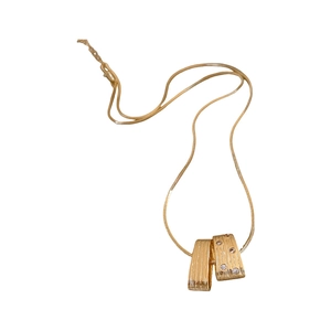 Irregular brushed golden pendant necklace with clear zircon stones on a snake chain