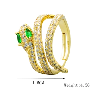 Detailed view of gold snake ring featuring green zircon eyes and 1.6cm size measurement