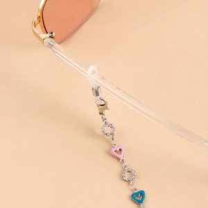 Detail of eyeglass chain featuring pink and blue heart charms and silicone loops
