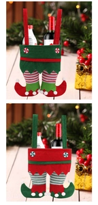 Detail of felt elf pant wine bottle bags with striped legs for Christmas gift wrapping