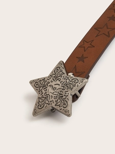 Close-up of star-shaped metal buckle with vintage carving on brown star-textured belt