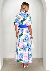 Back view of bohemian floral print dress with a navy belt and elegant A-line silhouette