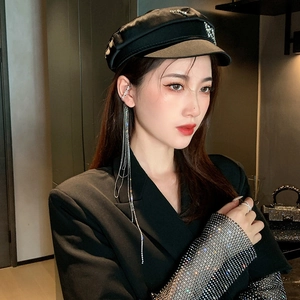 Silver rhinestone long tassel ear cuff shown with a fashion blazer for a chic look