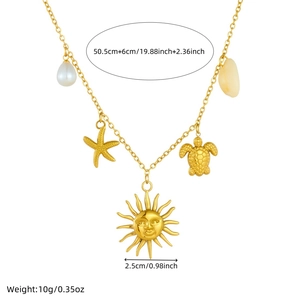 Gold-plated stainless steel necklace with sun, shell, and turtle pendants on white backdrop