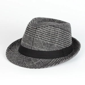 Detail of grey plaid wool fedora hat with black decorative silk ribbon on white background