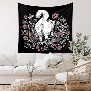 Detail showing the floral artistic pattern of a cat tapestry on a living room wall