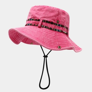Detail of pink cotton bucket hat with ethnic band and adjustable windproof cord