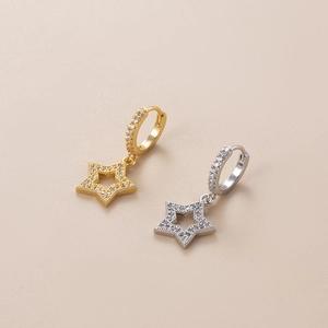 Sparkling gold and silver star dangle earrings with zircon stones and pave hoop closures