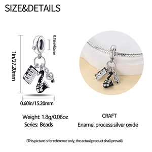 Detailed dimensions of silver music charm with saxophone, piano and treble clef
