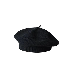 Classic black knitted beret hat for kids with ribbed edge in a solid minimalist style