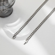 Detailed view of a silver Cuban link chain necklace made of durable stainless steel