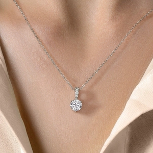 Elegant S925 sterling silver necklace featuring a sparkling round moissanite pendant