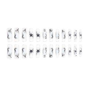 Blue star patterned translucent fake nails set with black celestial designs and rhinestones