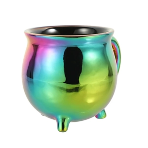 Detailed view of rainbow metallic witch cauldron mug with tripod feet on white backdrop