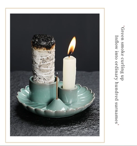 Macro detail of celadon ceramic lotus leaf holder for sage, candles, and incense sticks