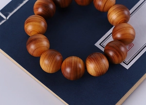 Macro detail of Argentine green sandalwood beads showing natural grain and texture