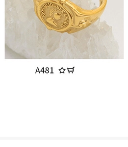 Macro detail of gold plated coin ring featuring Republique Francaise relief on crystal
