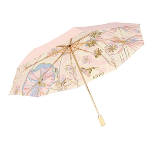 Pink folding umbrella with internal watercolor floral pattern and golden metal frame