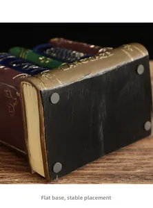 Detail of vintage resin book-shaped decor showing the flat base with non-slip pads