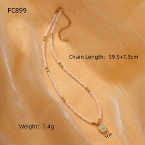 Sunflower rhodochrosite beaded necklace on orange silk background with square gold pendant
