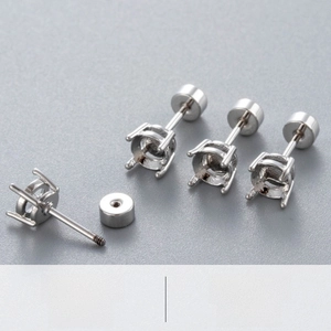 Detailed macro view of titanium steel four-prong earring stud with screw back closure