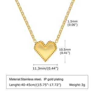 Detail of gold heart pendant showing dimensions of 11.3mm and beaded texture on stainless steel