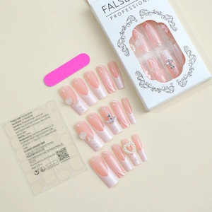 Detail of pink French press-on nails with 3D roses, pearls and adhesive tabs set
