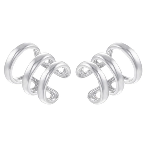 Close-up of minimalist triple-layered silver ear cuffs with smooth polished finish