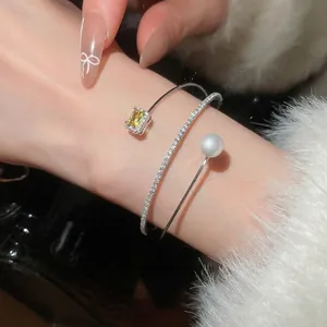 Three-layer open flower bracelet with yellow gemstone, white pearl, and zircon pavé bands