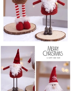 Detail of red and white felt Santa figurine with long legs and a solid wood base stand
