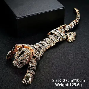 Luxurious tiger brooch with sparkling crystals and black enamel tiger stripes detail