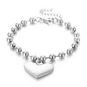 Polished silver heart pendant bracelet with round beads and lobster clasp on white background