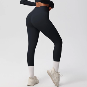 Detail view of high-waisted black yoga pants with side pockets and brushed fabric texture