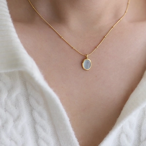 18K gold plated stainless steel necklace featuring a light blue natural stone pendant