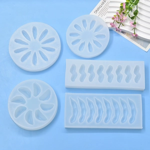 Peapod and peanut shaped silicone molds for DIY soap and candle making on blue background