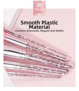 Detail of transparent diamond-filled makeup brush handles with silver metallic ferrules
