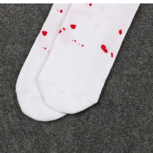 Close-up of white socks with realistic red blood splatter print for Halloween