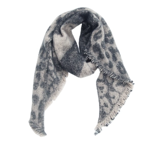 Close-up of gray and white leopard print scarf with soft fringe edges and boucle texture