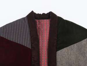 Detail of color-block velvet vest with burgundy, dark green, and tweed patchwork fabric